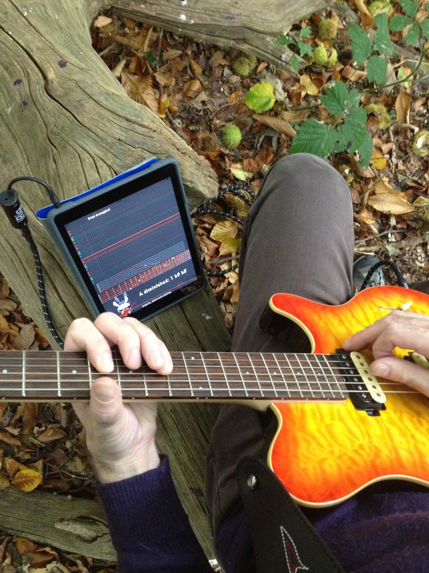 Playing Guitar Rabbit with an Ernie Ball Music Man electric guitar through the original iRig on an iPad
