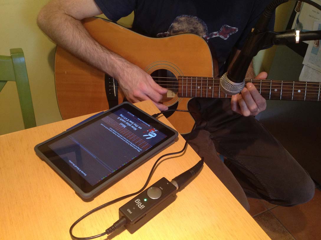 Playing Guitar Rabbit with an acoustic guitar through iRig PRO on an iPad